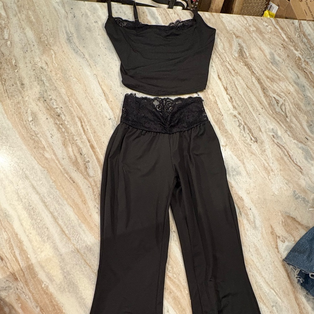 Matching black top and leggings with lace